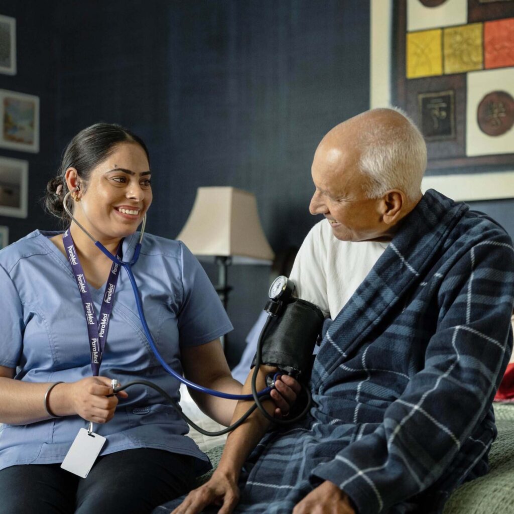 Nurse checking senior patient’s blood pressure